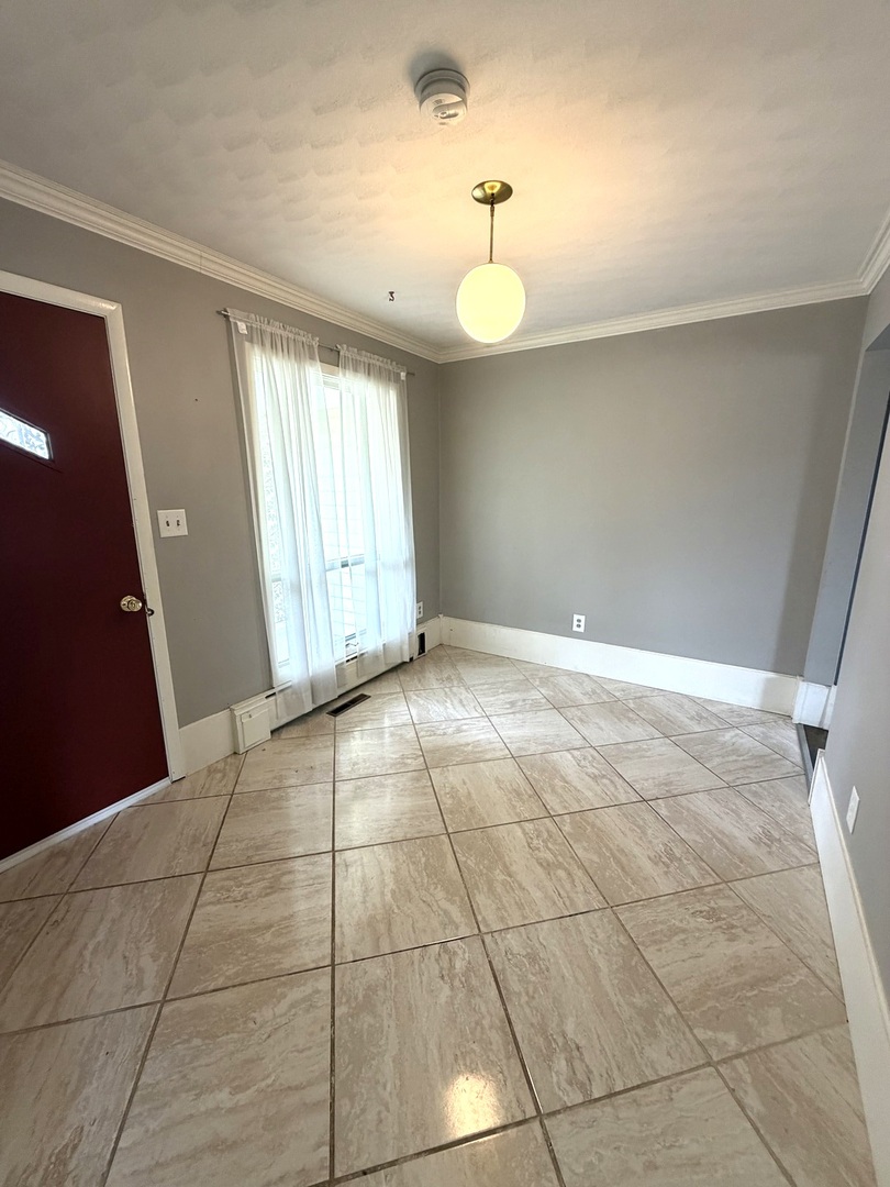 401 North Street Mazon, IL 60444 - Photo 3 of 23 a view of an empty room with a window