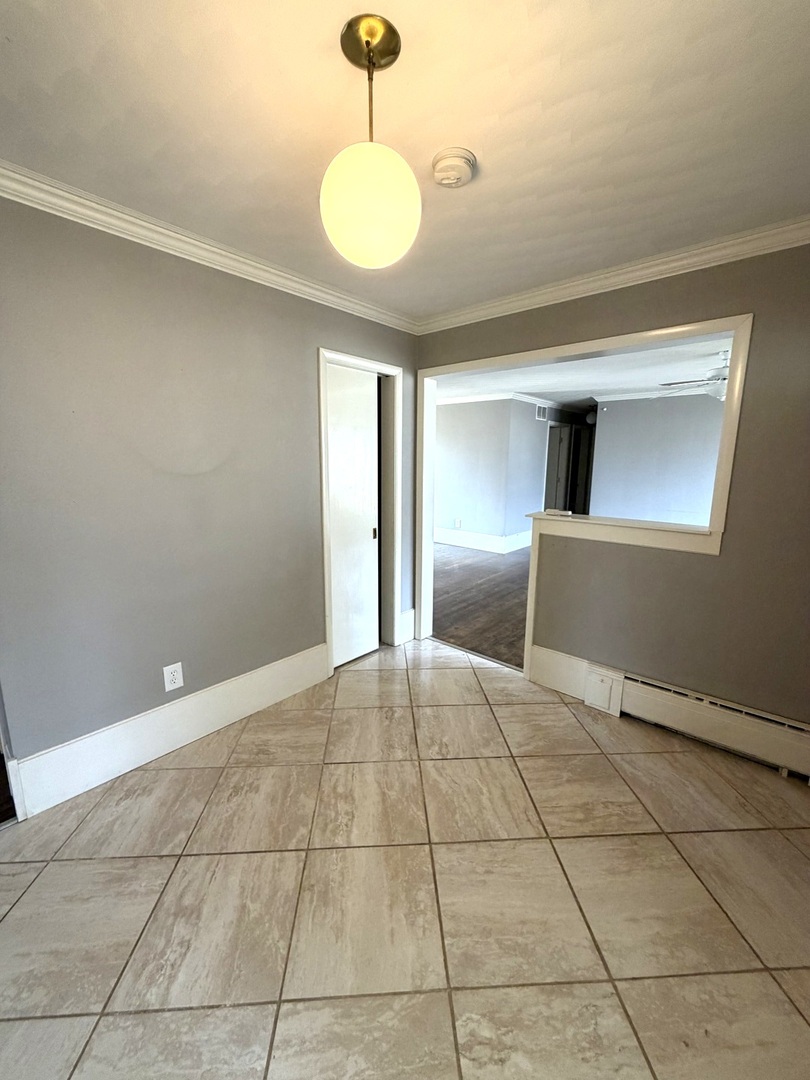 401 North Street Mazon, IL 60444 - Photo 4 of 23 a view of an empty room and window