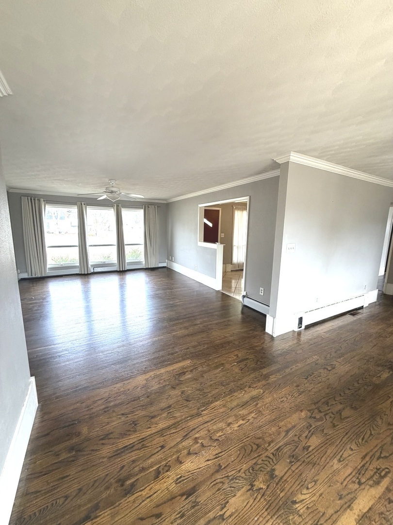401 North Street Mazon, IL 60444 - Photo 5 of 23 wooden floor in an empty room with a window