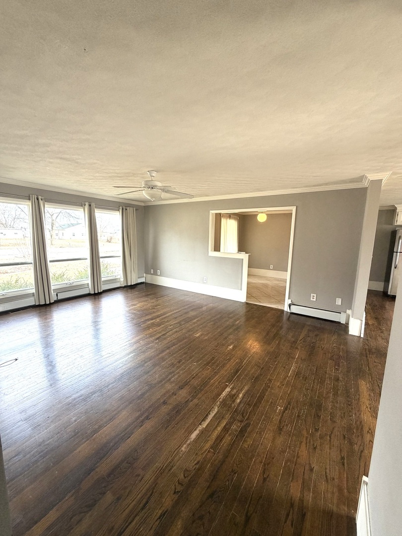 401 North Street Mazon, IL 60444 - Photo 7 of 23 wooden floor in an empty room with a window