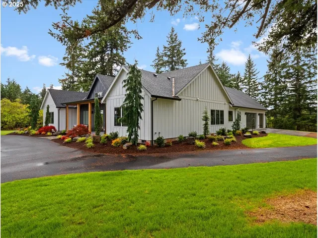 a front view of a house with swimming pool yard and outdoor seating