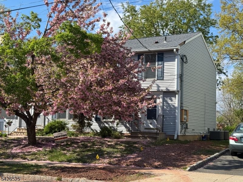 87 Fairview Avenue Somerville, NJ 08876 - Photo 1 of 19 a front view of a house with garden