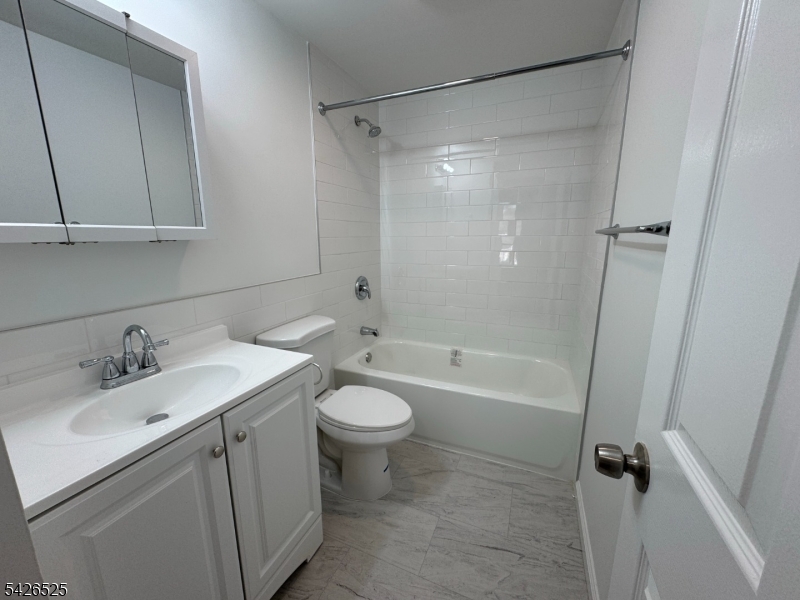 87 Fairview Avenue Somerville, NJ 08876 - Photo 12 of 19 a bathroom with a sink a toilet and shower