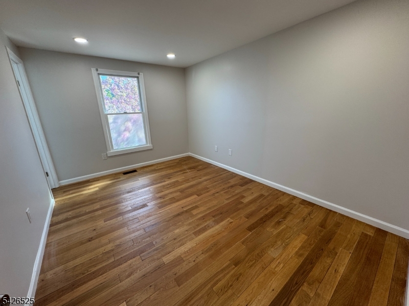 87 Fairview Avenue Somerville, NJ 08876 - Photo 13 of 19 an empty room with window