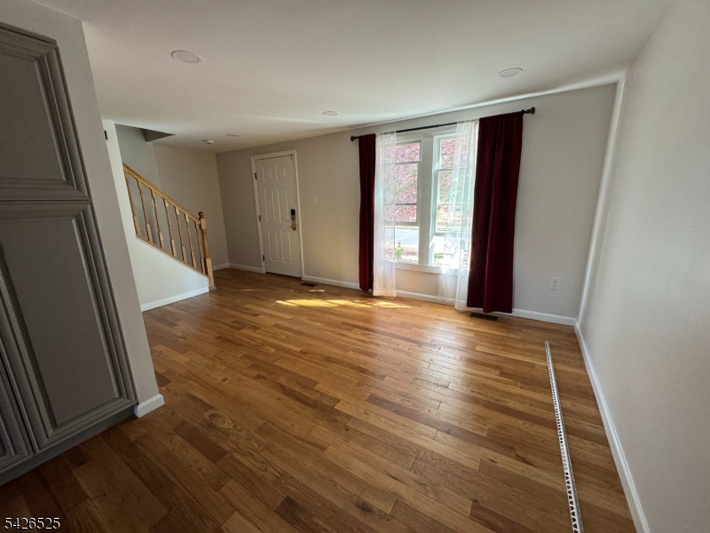 87 Fairview Avenue Somerville, NJ 08876 - Photo 7 of 19 a view of a room with wooden floor and window
