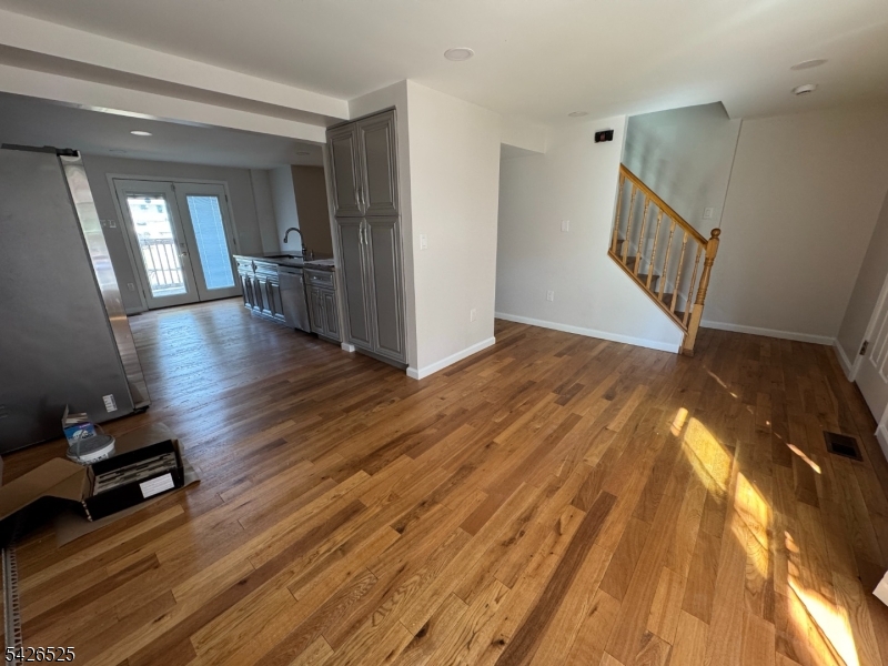 87 Fairview Avenue Somerville, NJ 08876 - Photo 8 of 19 a view of empty room with wooden floor and fan