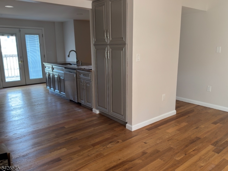 87 Fairview Avenue Somerville, NJ 08876 - Photo 9 of 19 wooden floor in an empty room with a window