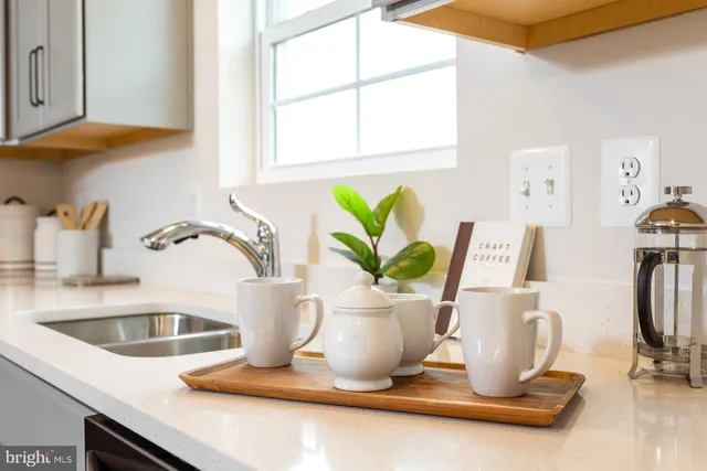 a kitchen with a two sink and a window