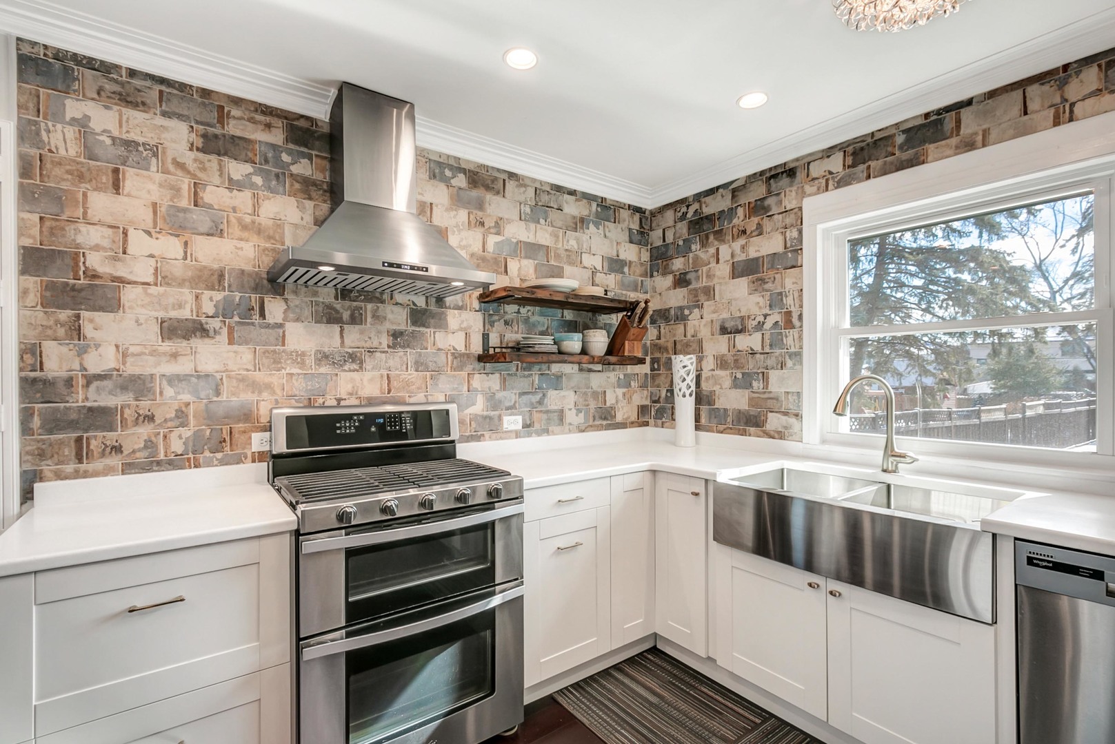 49 Northgate Road Riverside, IL 60546 - Photo 6 of 19 a kitchen with a stove and white cabinets