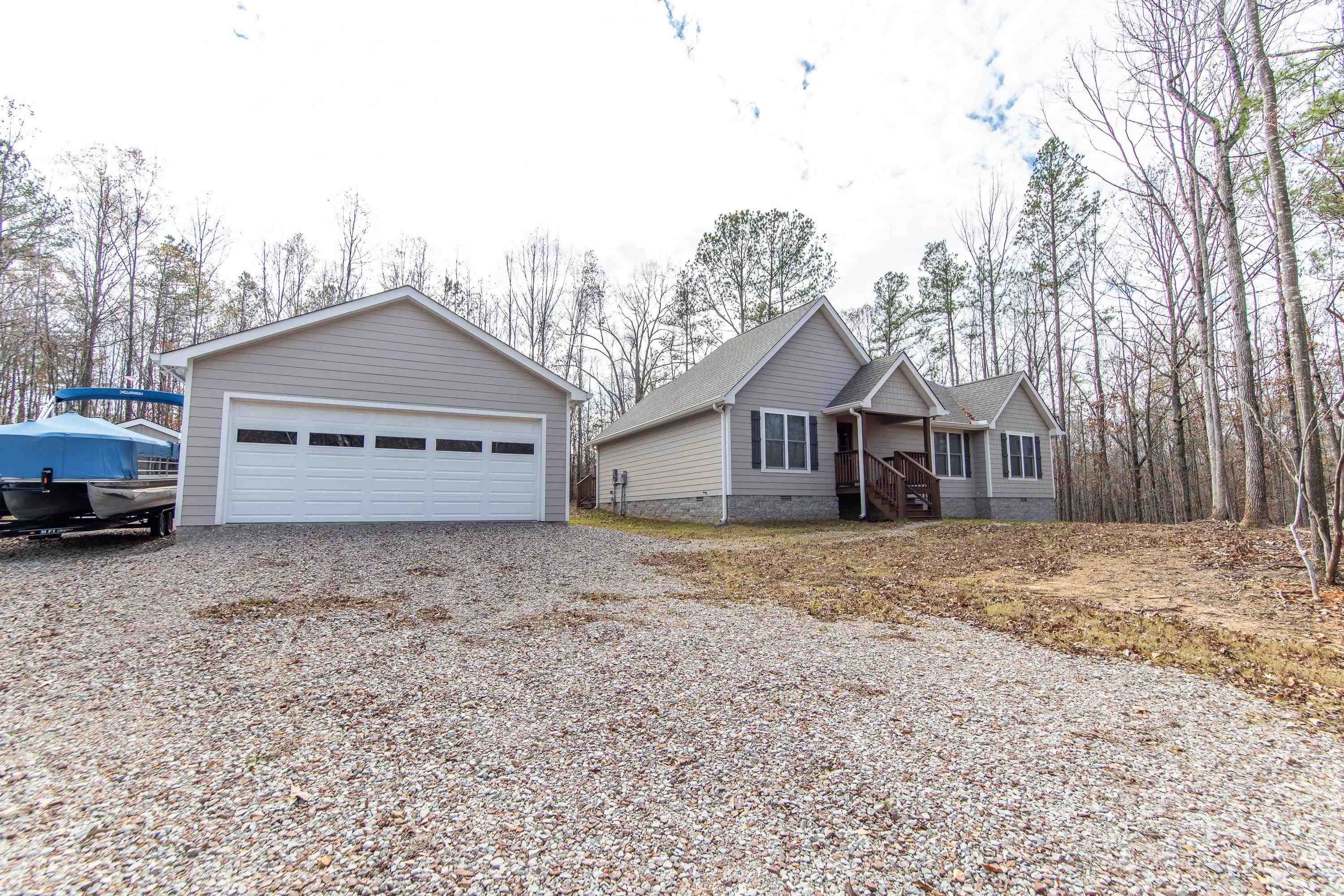 a view of a house with a yard covered in snow