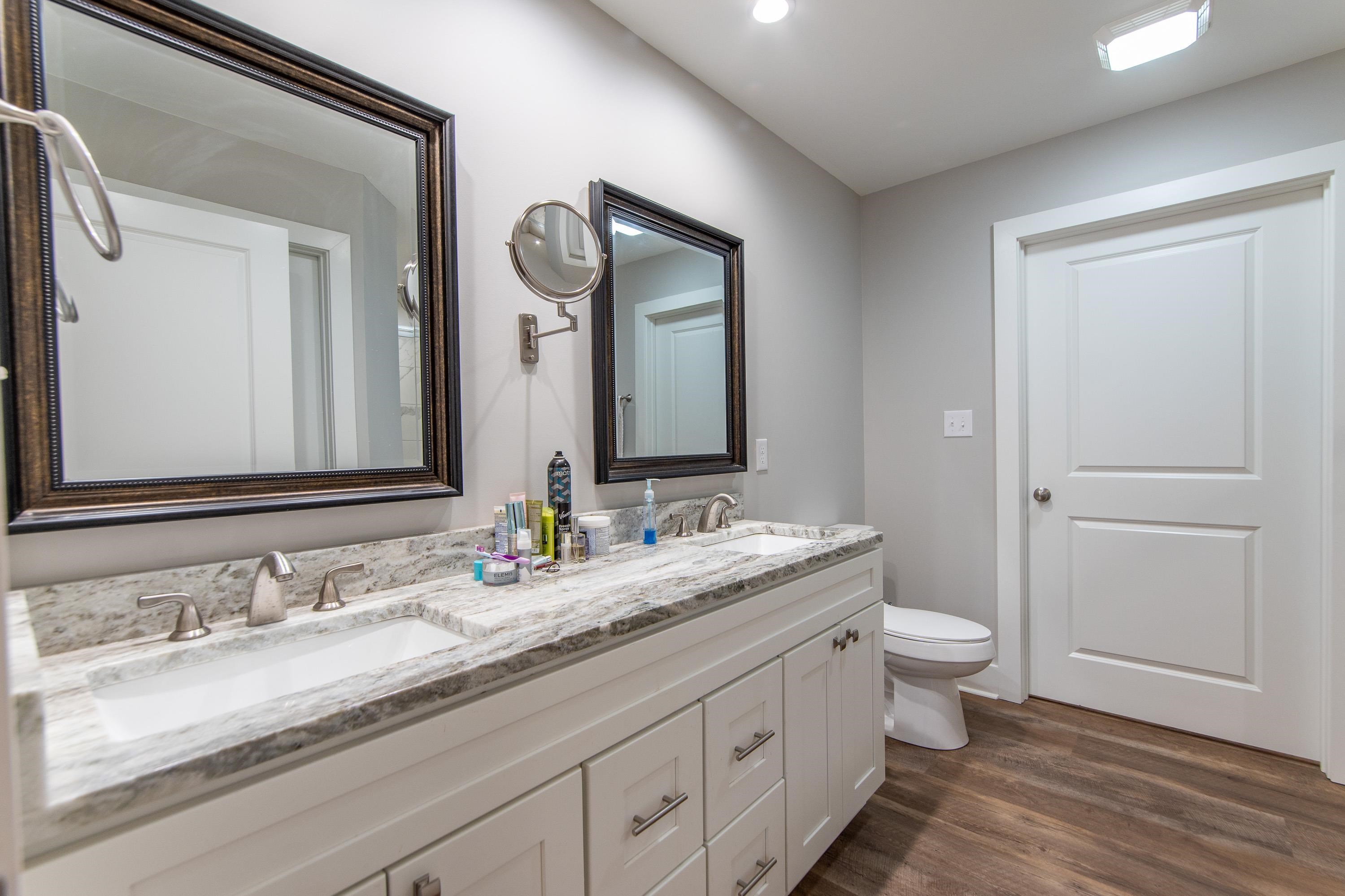 85 Rustic Trail Counce, TN 38326 - Photo 11 of 24 a bathroom with a granite countertop sink and a mirror