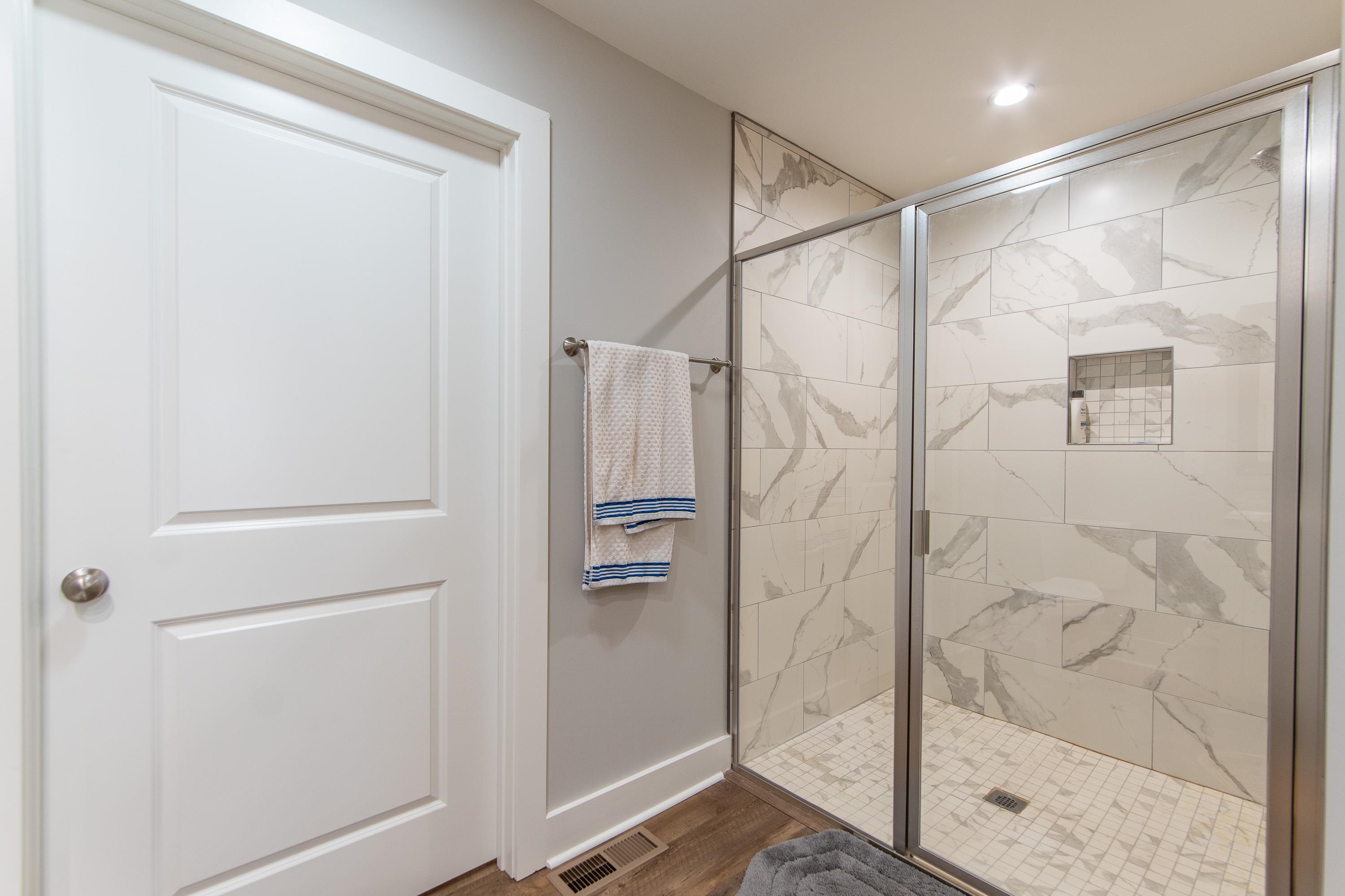 85 Rustic Trail Counce, TN 38326 - Photo 13 of 24 a bathroom with a glass shower door