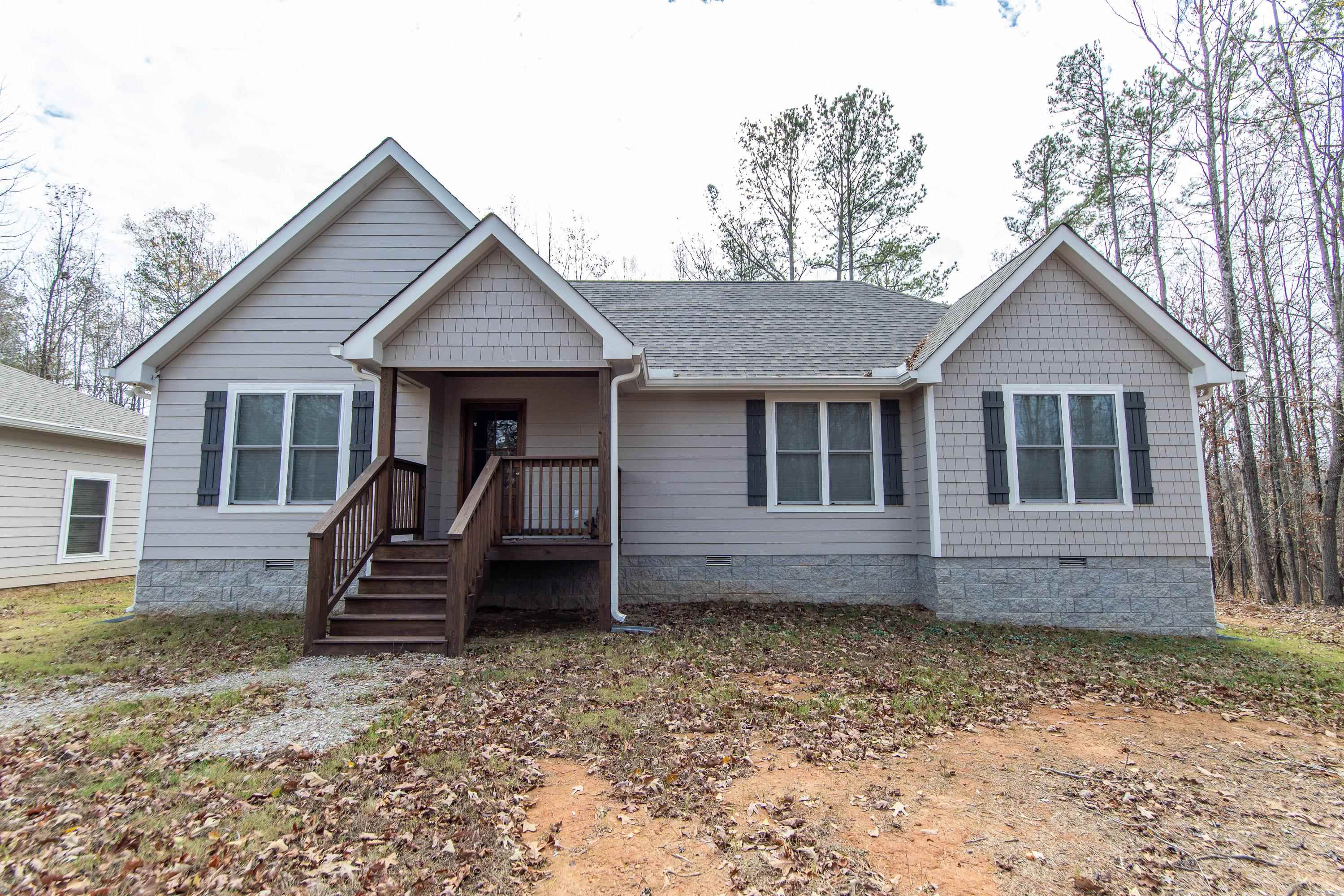 85 Rustic Trail Counce, TN 38326 - Photo 2 of 24 a front view of a house with garden