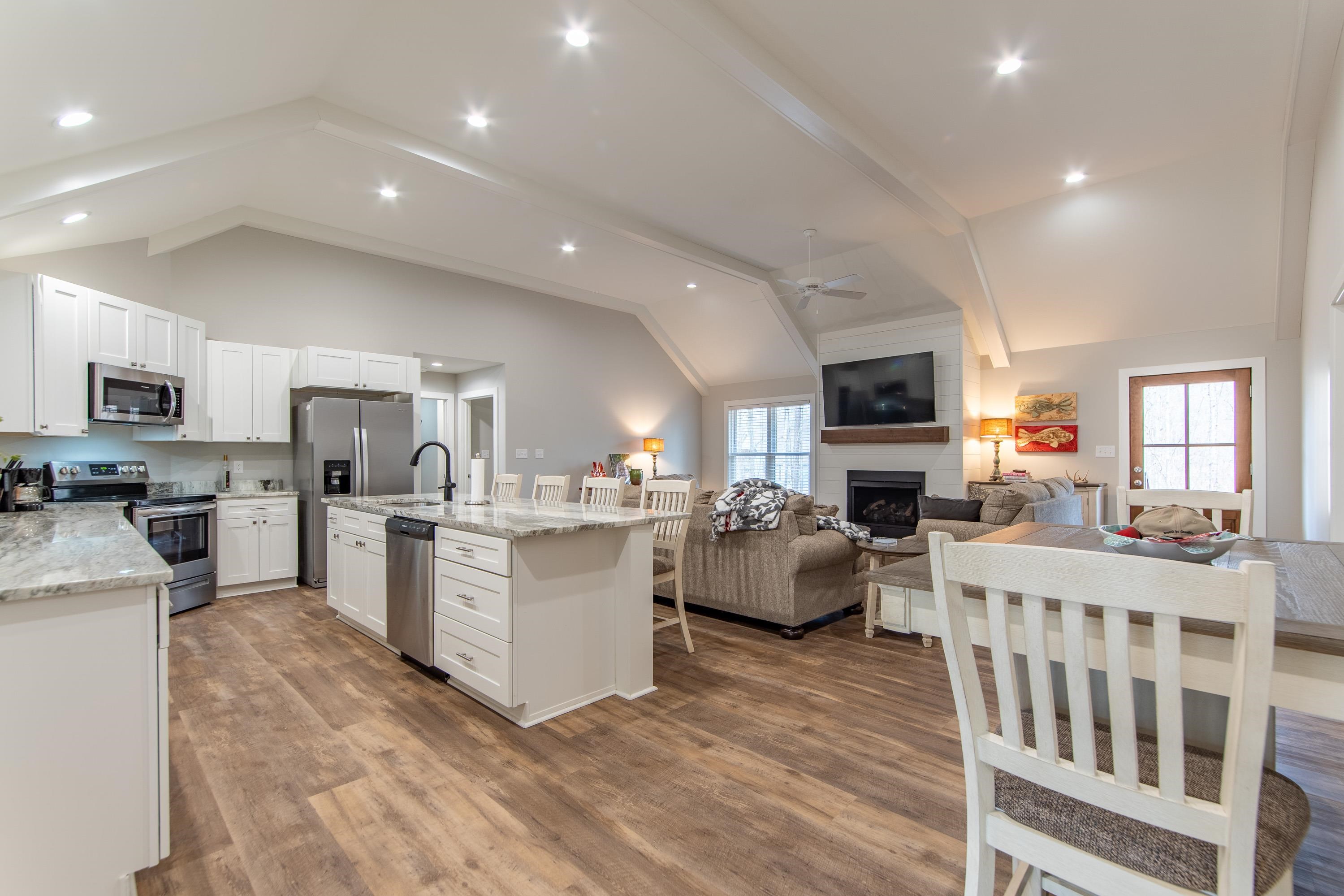 85 Rustic Trail Counce, TN 38326 - Photo 4 of 24 a large white kitchen with lots of counter top space a sink appliances and cabinets