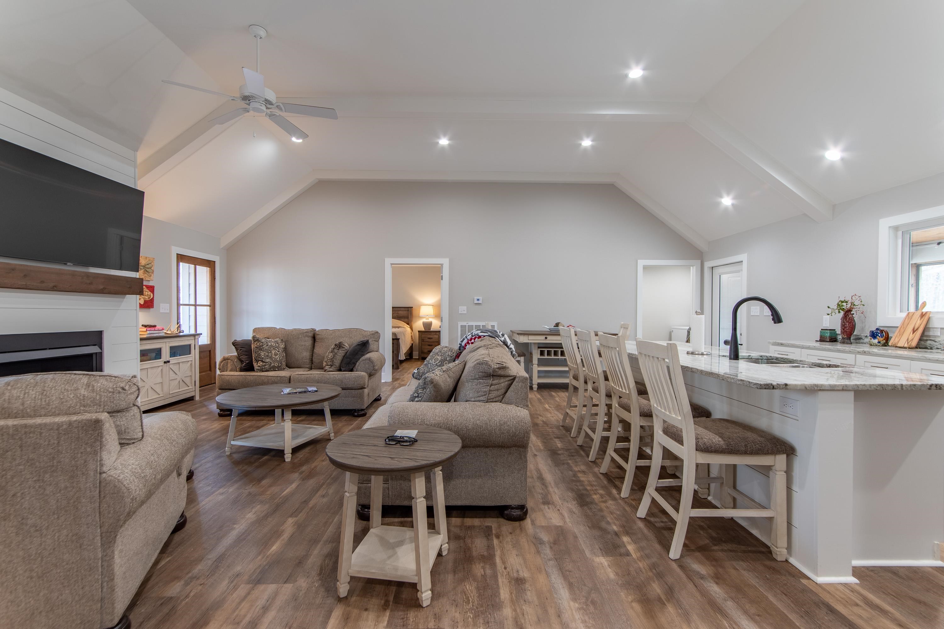 85 Rustic Trail Counce, TN 38326 - Photo 7 of 24 a living room with furniture a flat screen tv and kitchen view