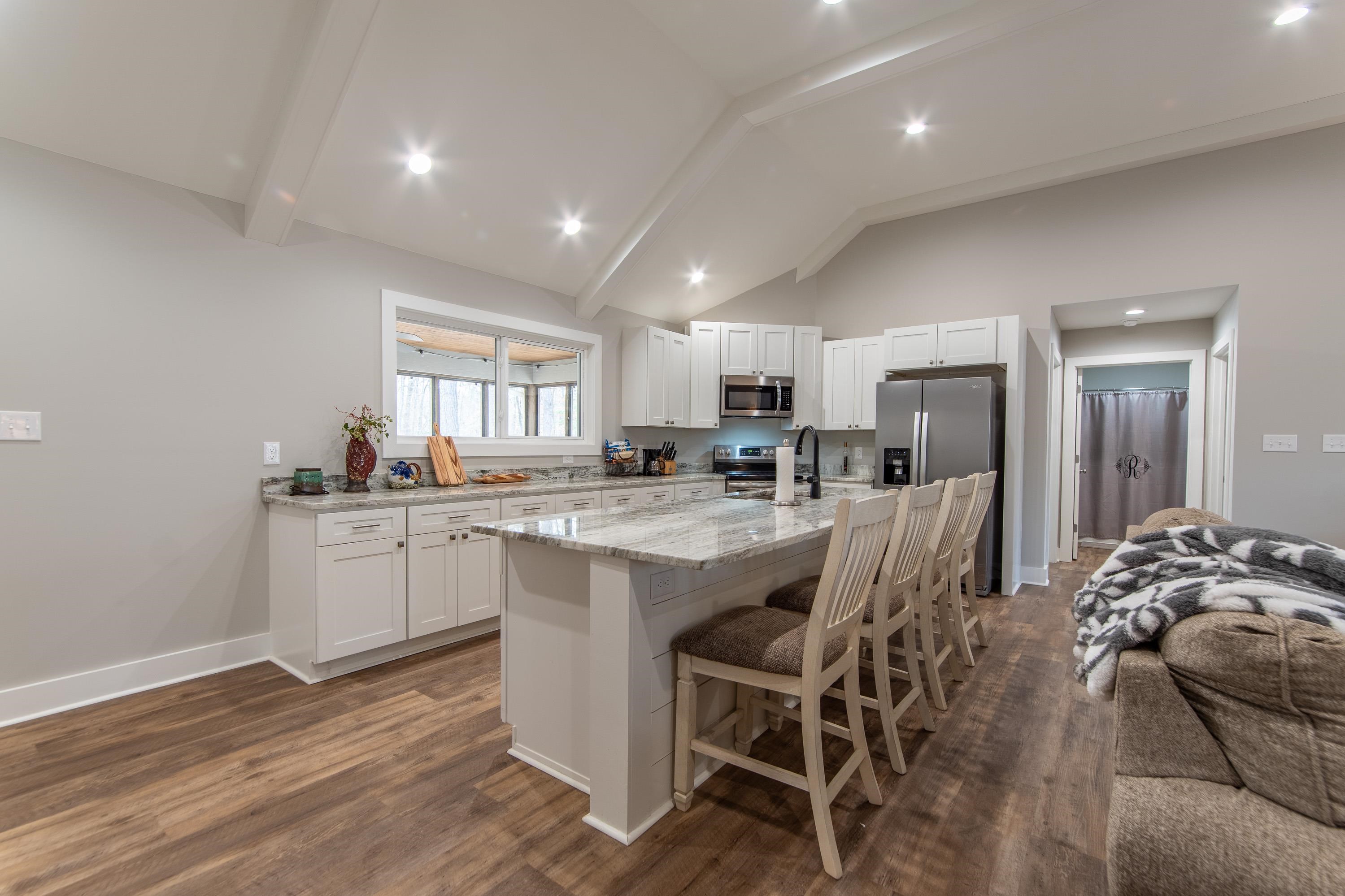 85 Rustic Trail Counce, TN 38326 - Photo 8 of 24 a kitchen with white cabinets and refrigerator