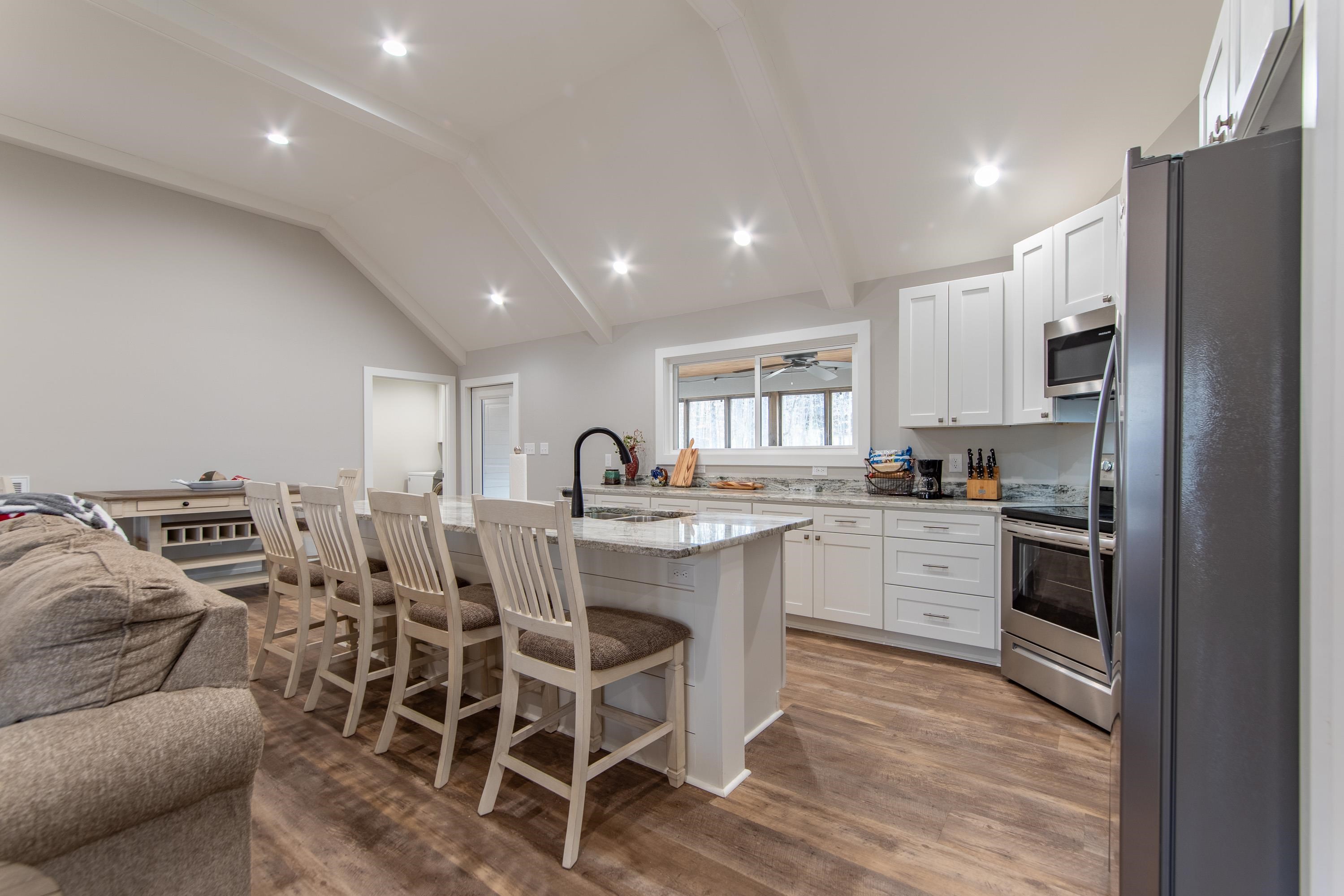 85 Rustic Trail Counce, TN 38326 - Photo 9 of 24 a kitchen with white cabinets and stainless steel appliances