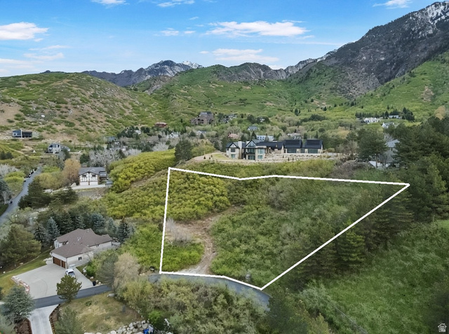 10667 Hidden Ridge Lane Sandy, UT 84092 - Photo 15 of 21 Aerial overview of property's location with a mountain backdrop and property boundaries highlighted