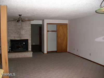 6261 Ashue Road Wapato, WA 98951 - Photo 4 of 15 a view of empty room with a fireplace