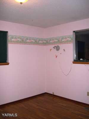 6261 Ashue Road Wapato, WA 98951 - Photo 9 of 15 a view of a room with wooden floor and cabinet