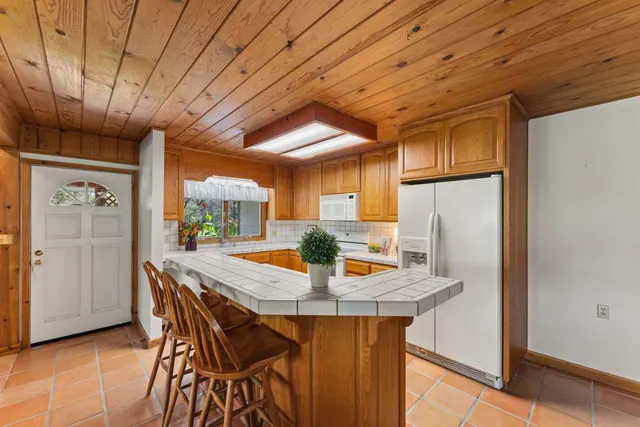 a view of a kitchen with granite countertop lots of counter top space