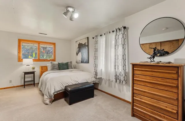 a view of a room with wooden floor and chair