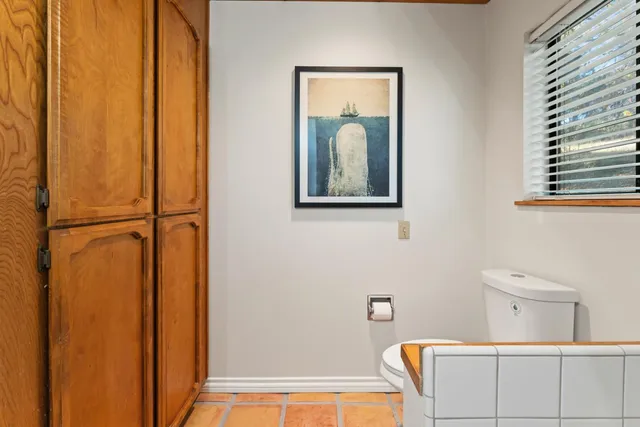 a bedroom with furniture and a window