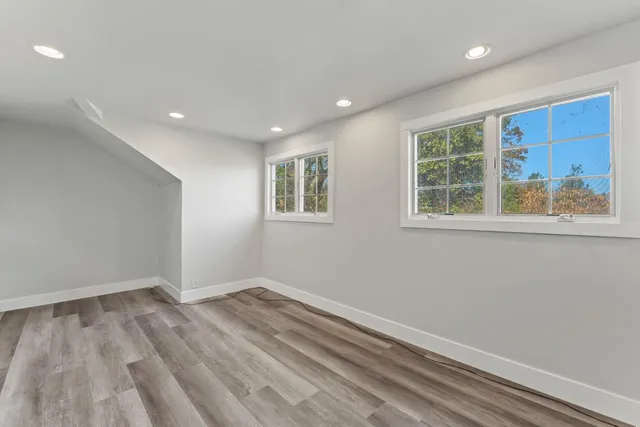 a view of front door with wooden floor