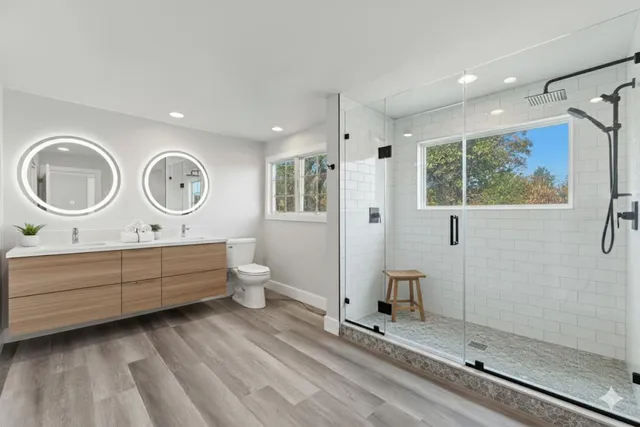 a front view of a house with yard and green space