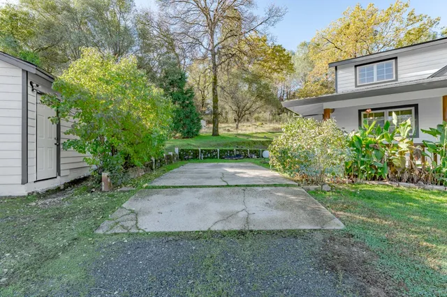 an aerial view of residential house and sandy dunes