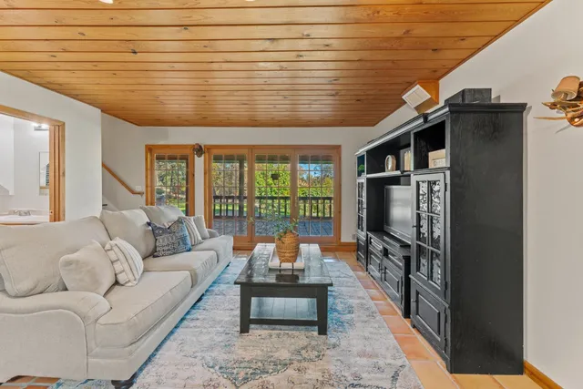 a view of a dining room with furniture and window