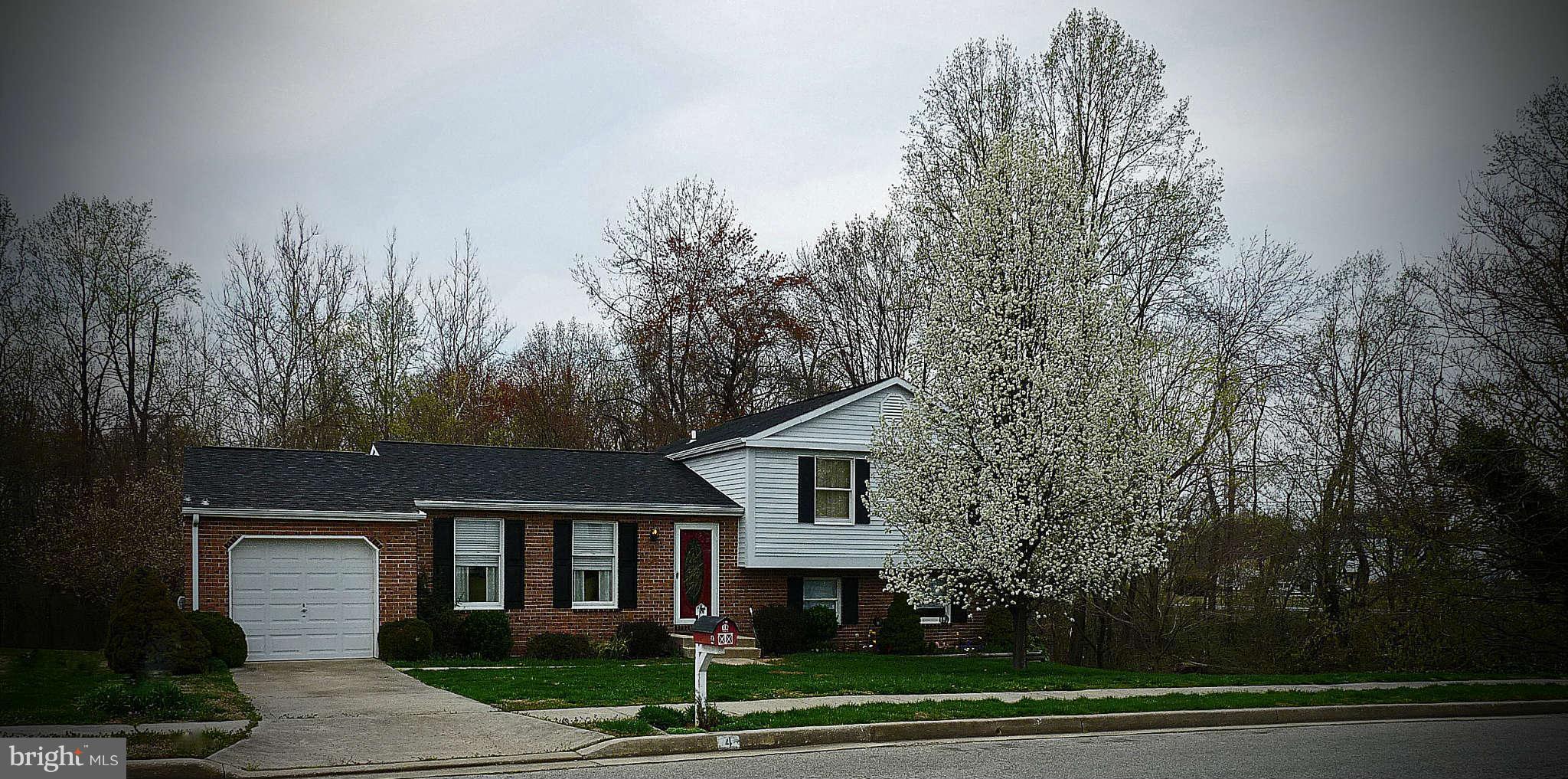 4 Box Baltimore, MD 21221 - Photo 1 of 30 a front view of a house with a garden and trees