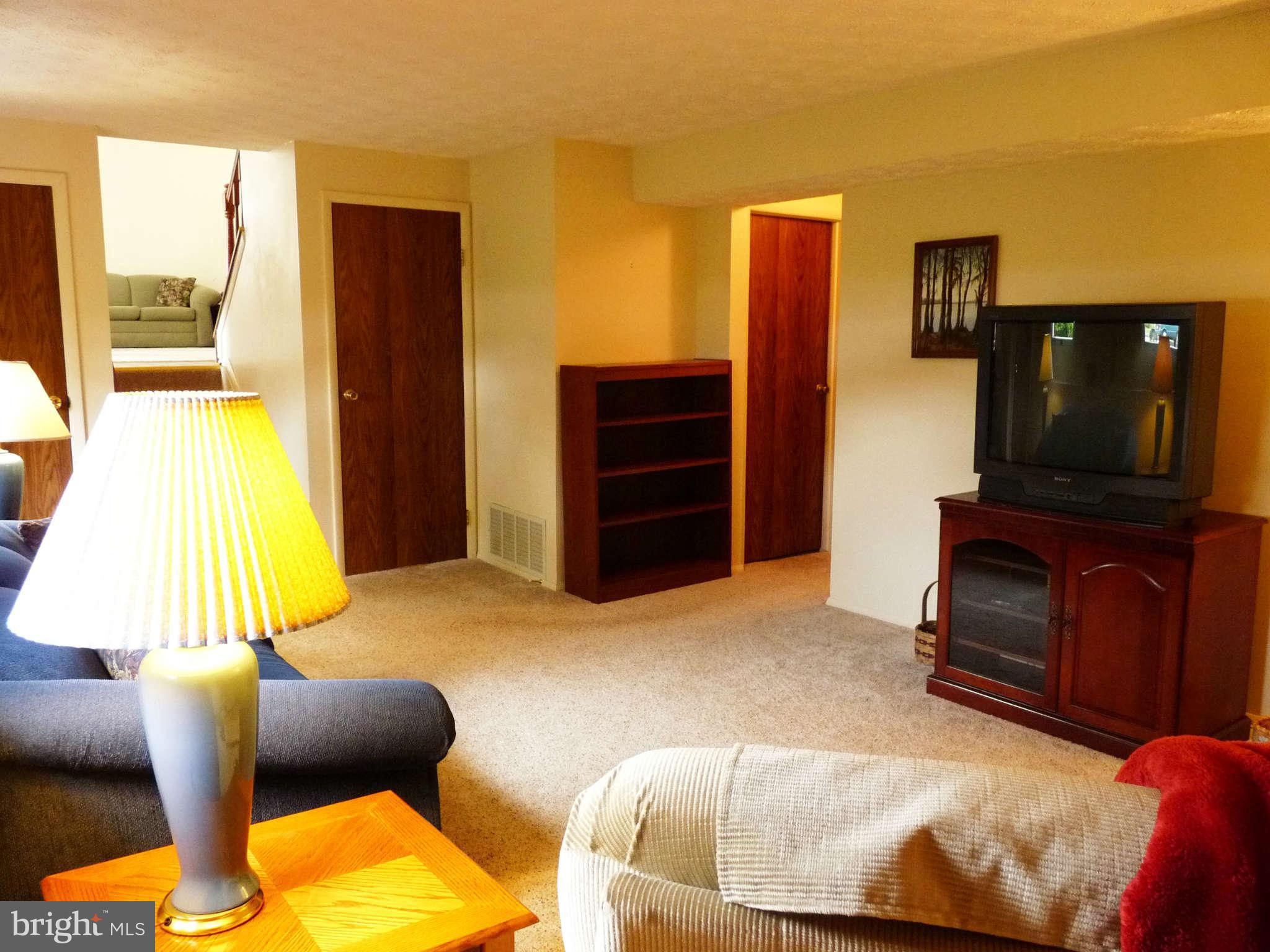 4 Box Baltimore, MD 21221 - Photo 20 of 30 a living room with furniture and a flat screen tv