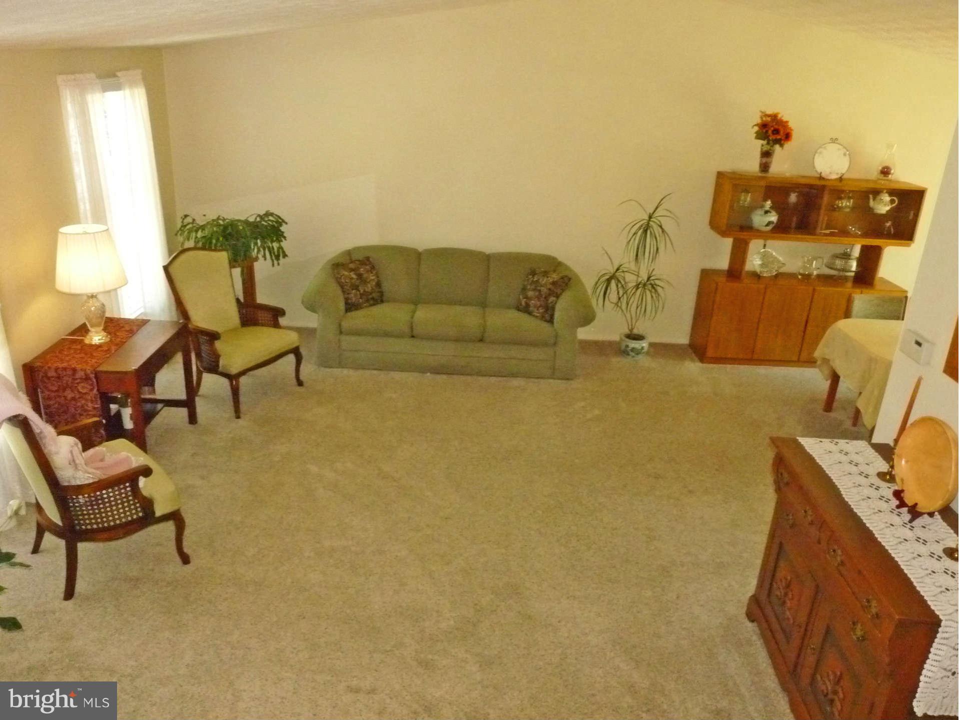 4 Box Baltimore, MD 21221 - Photo 3 of 30 a living room with couches and a couch with wooden floor