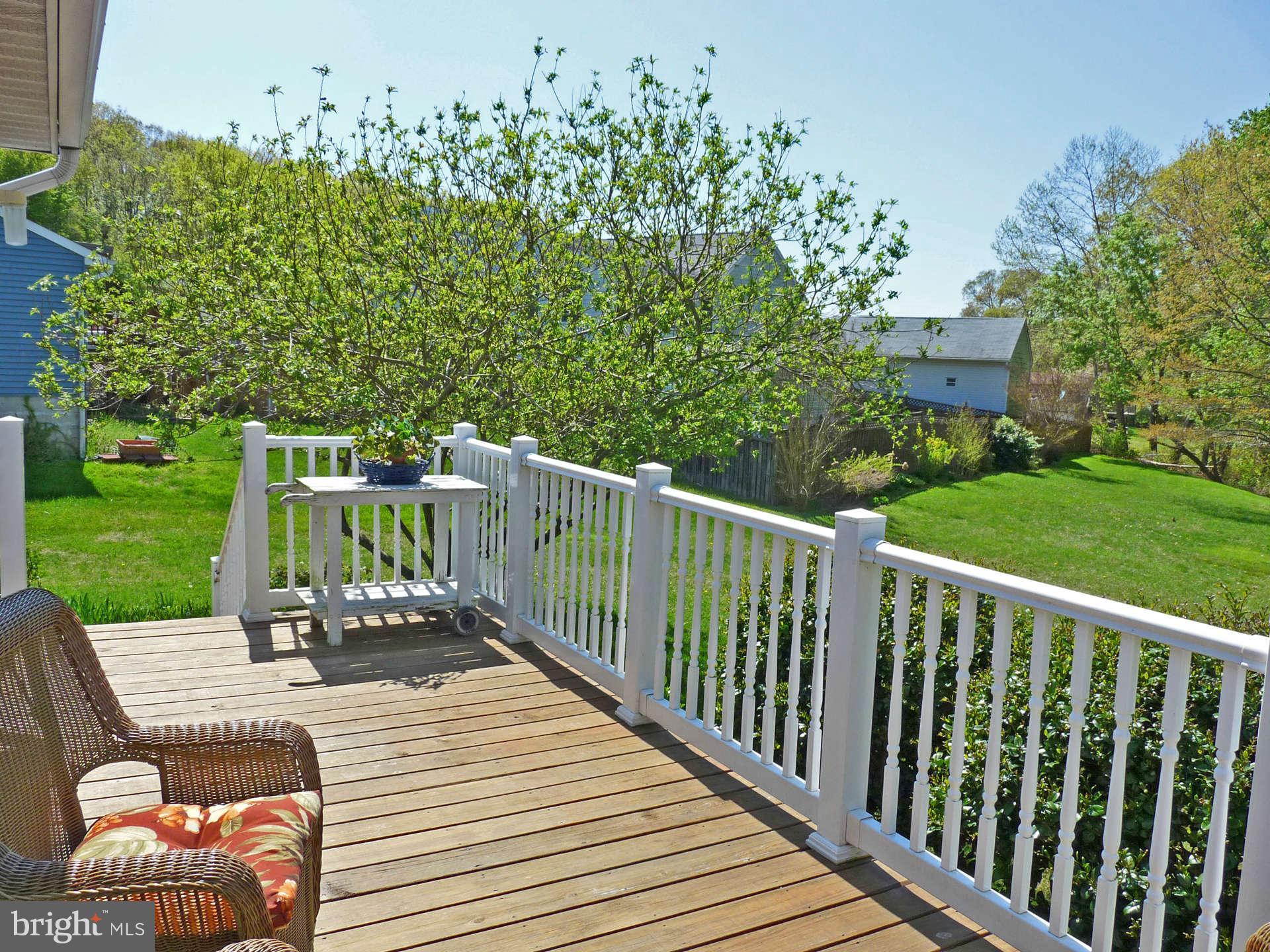 4 Box Baltimore, MD 21221 - Photo 25 of 30 a view of a chairs and table on the wooden deck