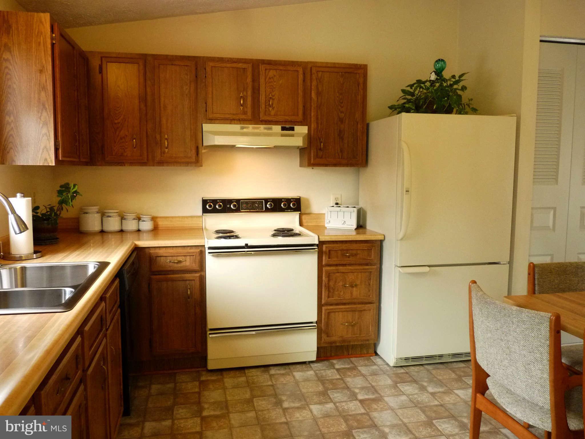 4 Box Baltimore, MD 21221 - Photo 7 of 30 a kitchen with a refrigerator sink stove and cabinets