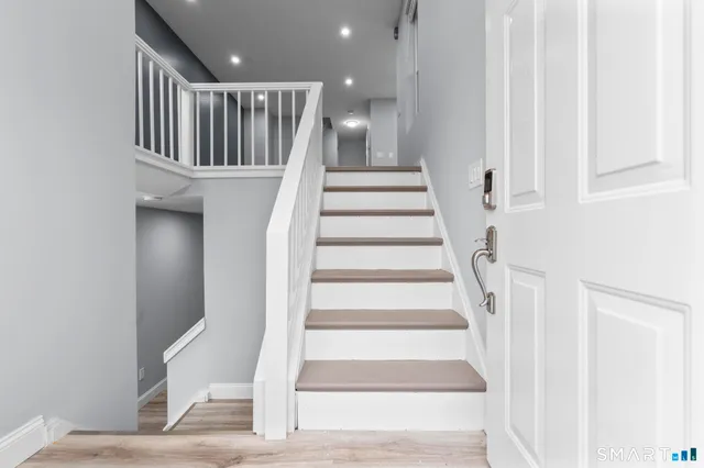 a view of staircase with white walls and white walls
