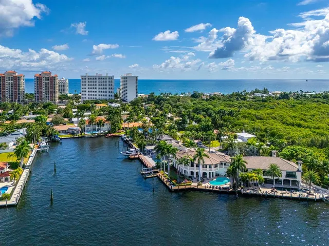 a view of swimming pool with outdoor seating and a garden