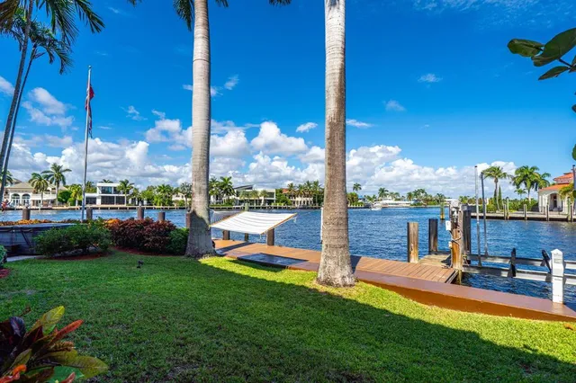 a kitchen with stainless steel appliances granite countertop a sink a stove and cabinets