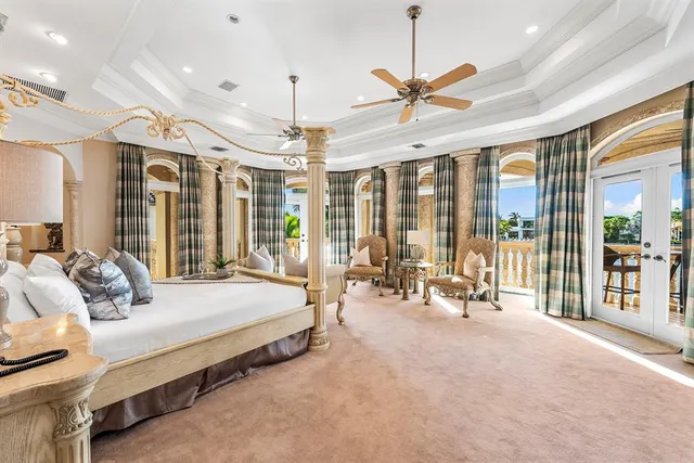 a bedroom with a bed and a mirror