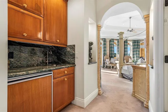 a view of a dining room with furniture wooden floor and a potted plant