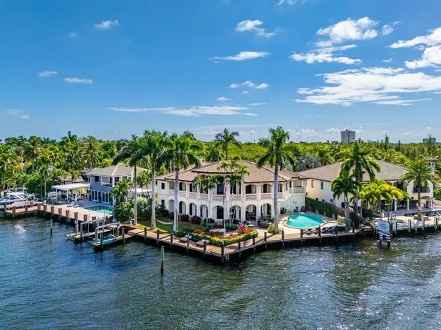 a view of a swimming pool with a table and chairs