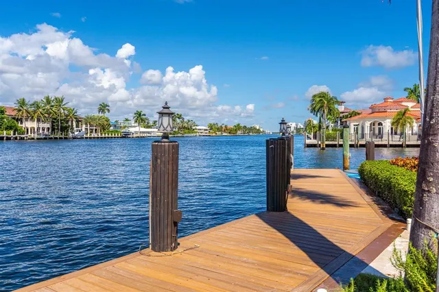 a view of a dining room with furniture and a chandelier