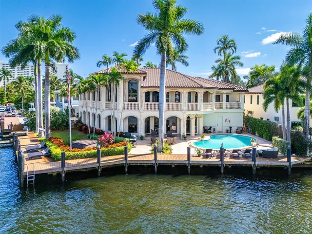 a view of a swimming pool with outdoor seating