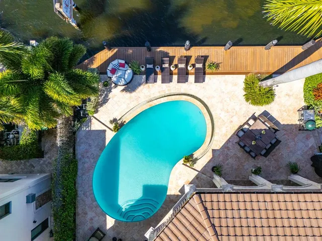 a view of a swimming pool with a patio