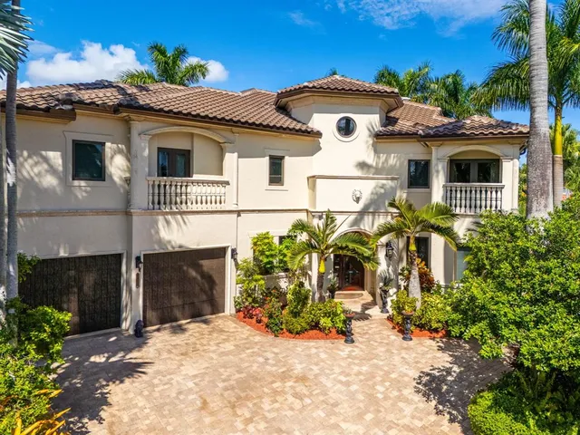 a view of a patio with table and chairs and potted plants