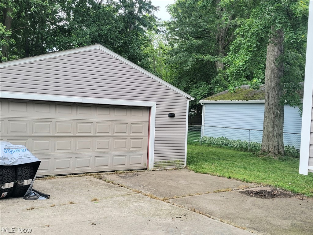 4895 Lear Nagle Road North Ridgeville, OH 44039 - Photo 26 of 27 Garage with a yard