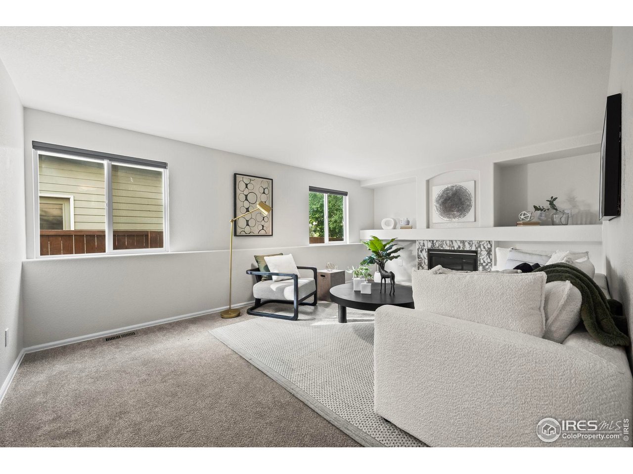 2529 Azalea Way Erie, CO 80516 - Photo 14 of 32 a living room with furniture and a window