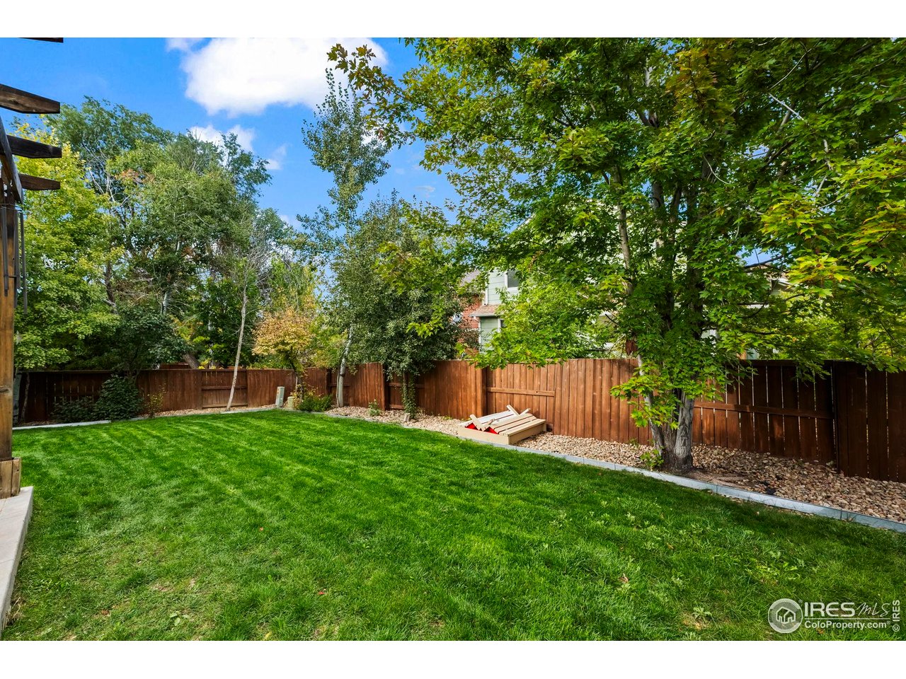 2529 Azalea Way Erie, CO 80516 - Photo 26 of 32 a view of a backyard with a small cabin