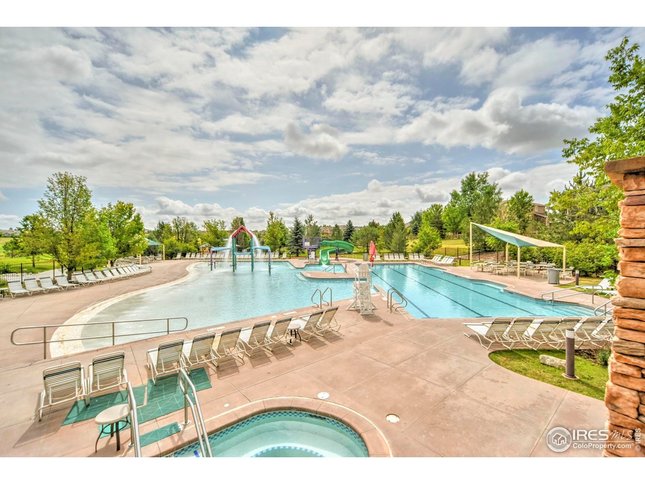 2529 Azalea Way Erie, CO 80516 - Photo 27 of 32 a view of a swimming pool with an outdoor seating